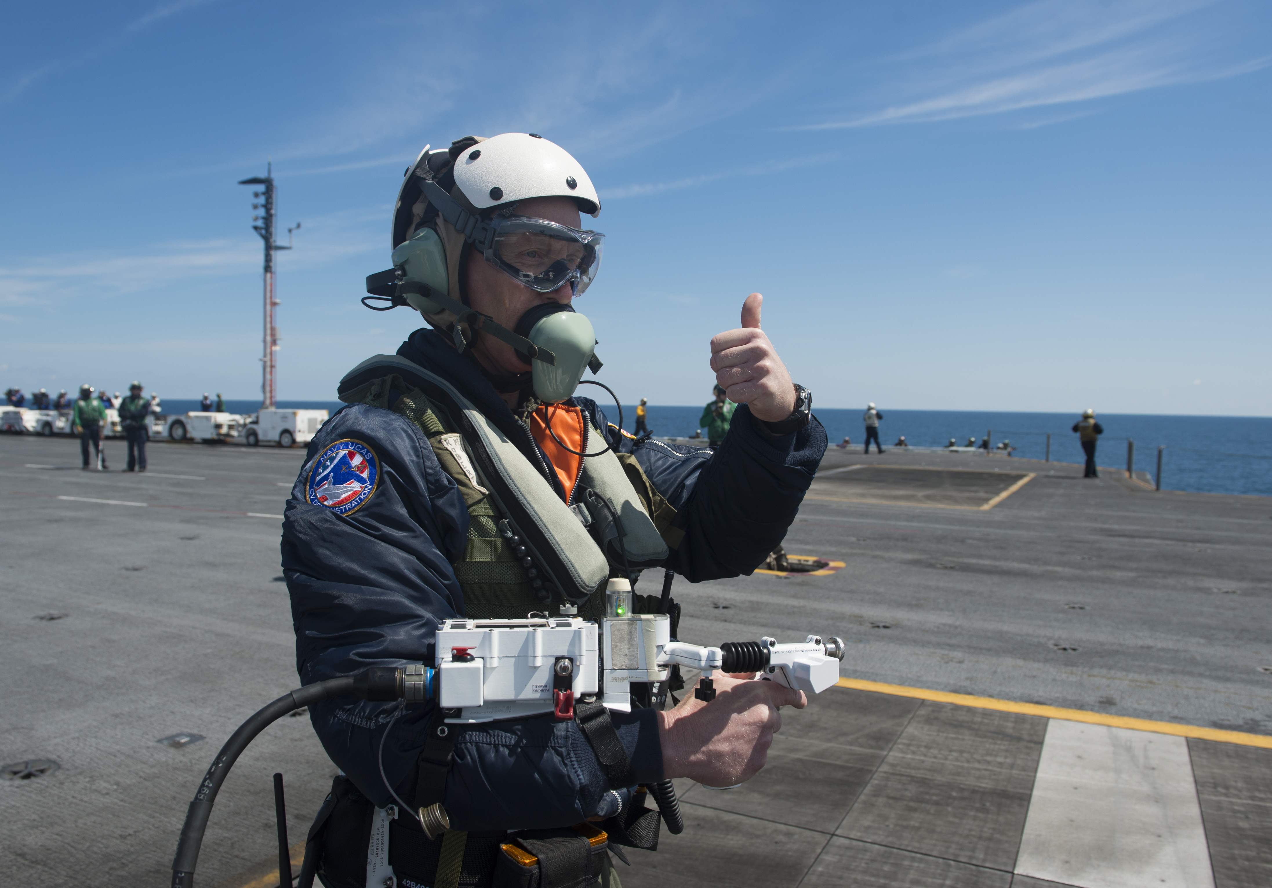 message-editor%2F1520986240729-dave_lorenz_a_deck_operator_with_northrop_grumman_acknowledges_that_he_has_control_of_an_x-47b_unmanned_combat_air_system_demonstrator_as_he_moves_it_via_an_arm-mounted_controller_on_the_flight_deck_of_130514-n-fu443-673.jpg